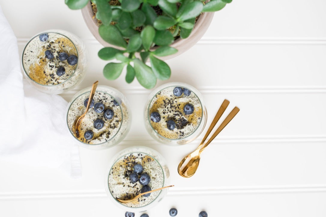 Glass cups filled with chia seeds and berries