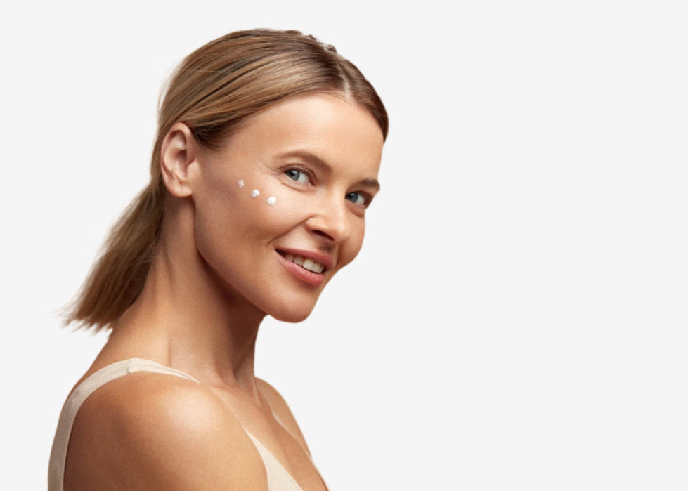 A lady with age defying eye cream applied under her eye.