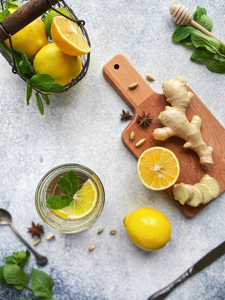 Lemons and ginger sliced on a chopping board