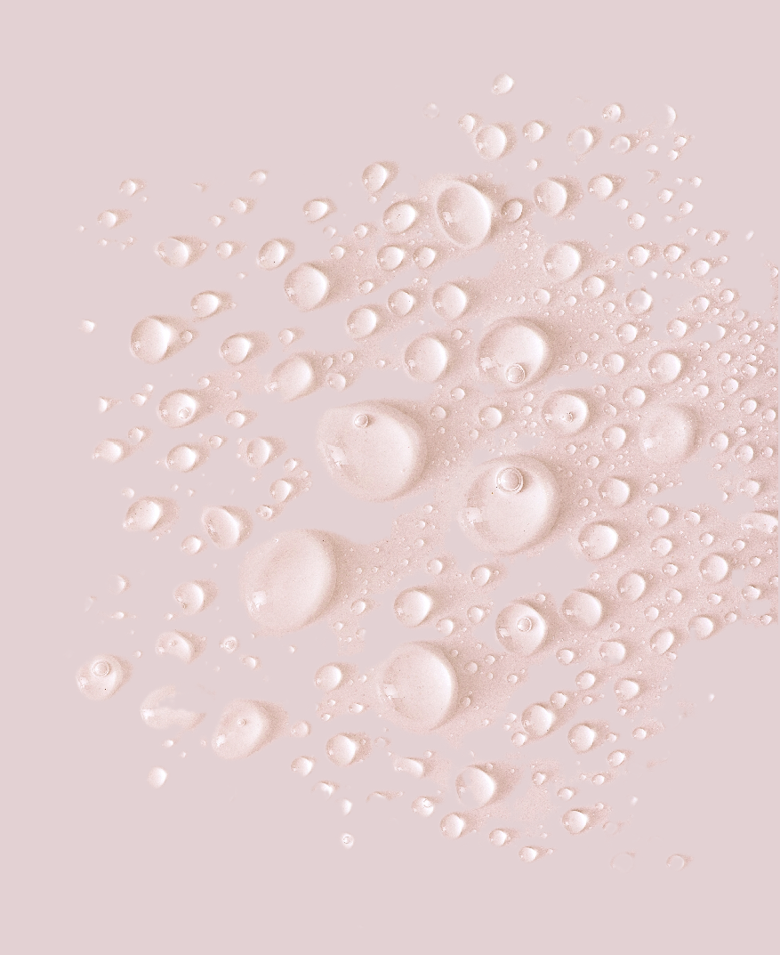 Droplets of balancing mist on pink background