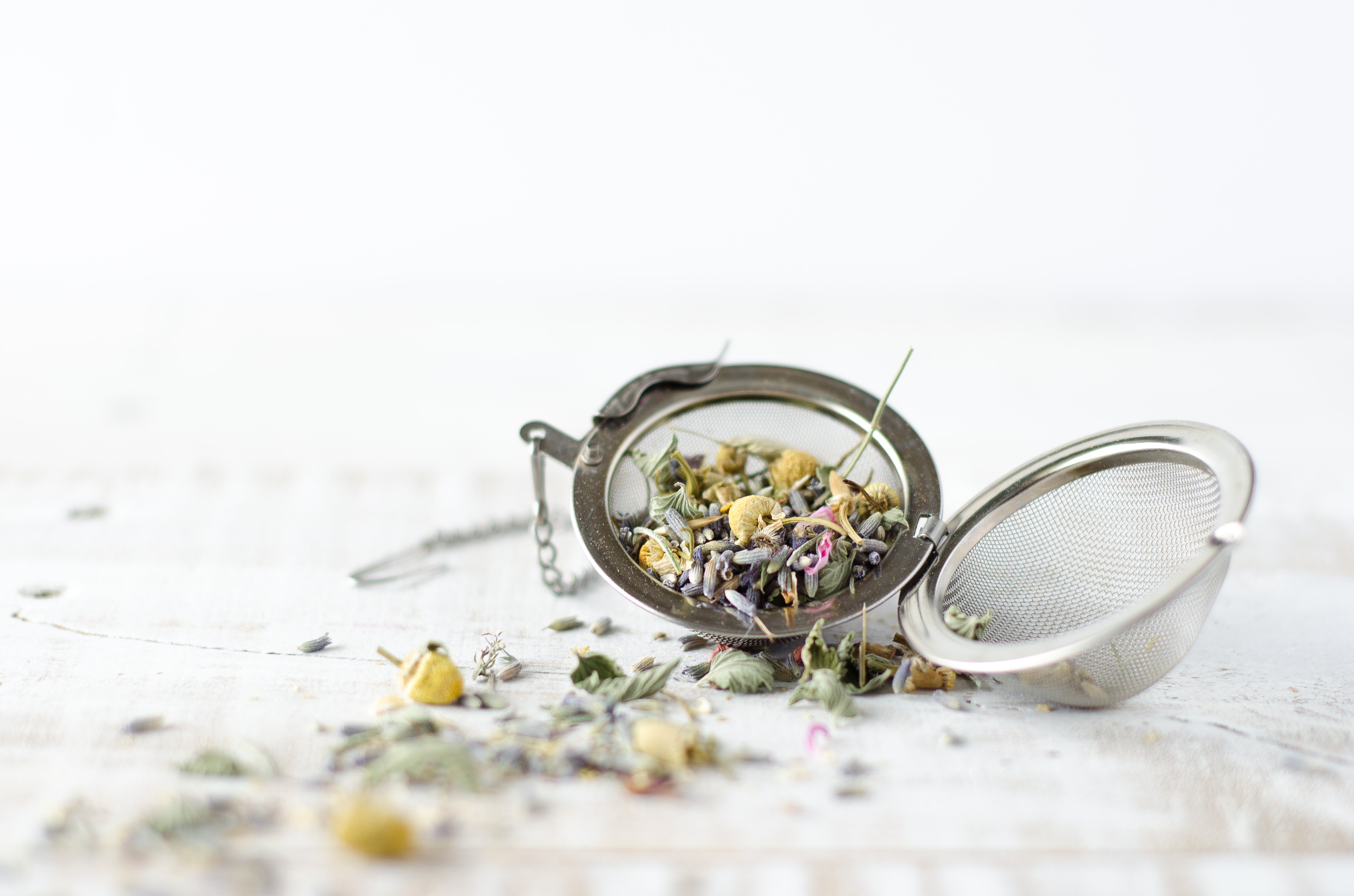 A tea strainer with loose leaf herbal tea