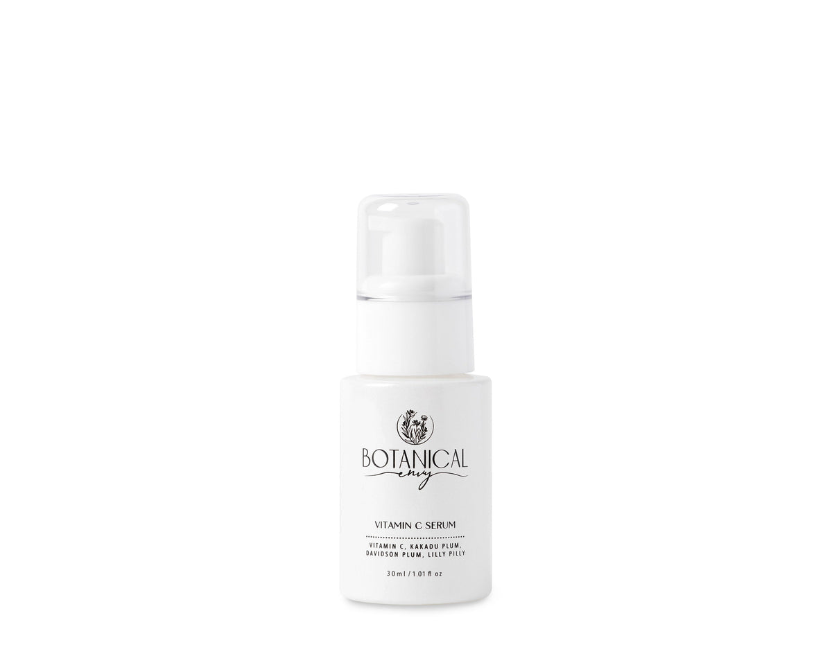 A white bottle of Botanical Envy Vitamin C serum against a white background
