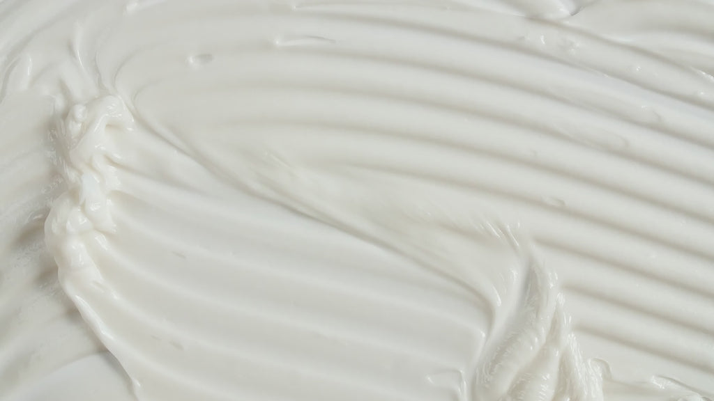 Moisturiser being spread with a spatula